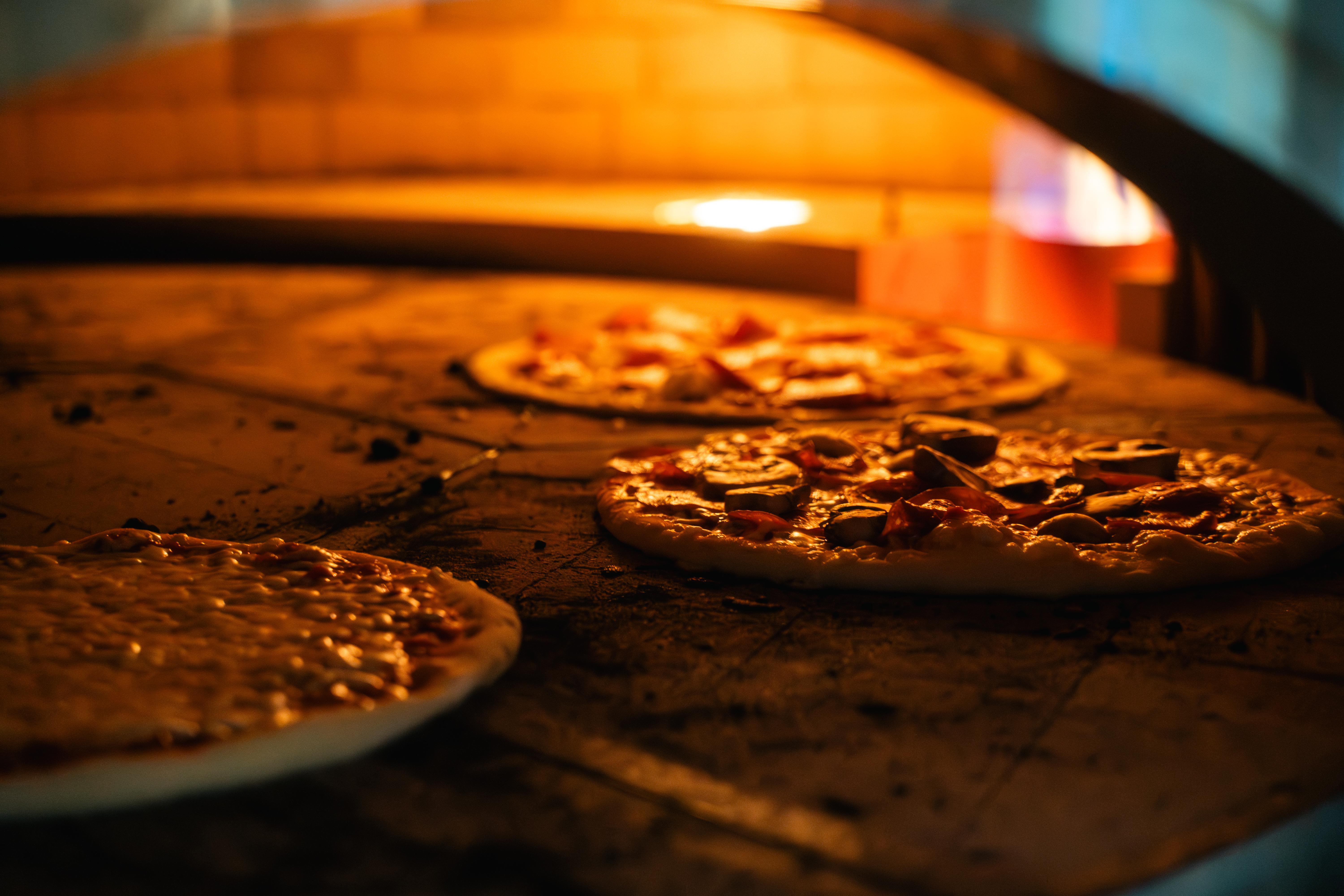 Our in-house kitchen turns out signature wood-fired pizza